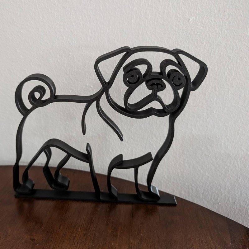 Customer photo of pug sculpture on a wood table