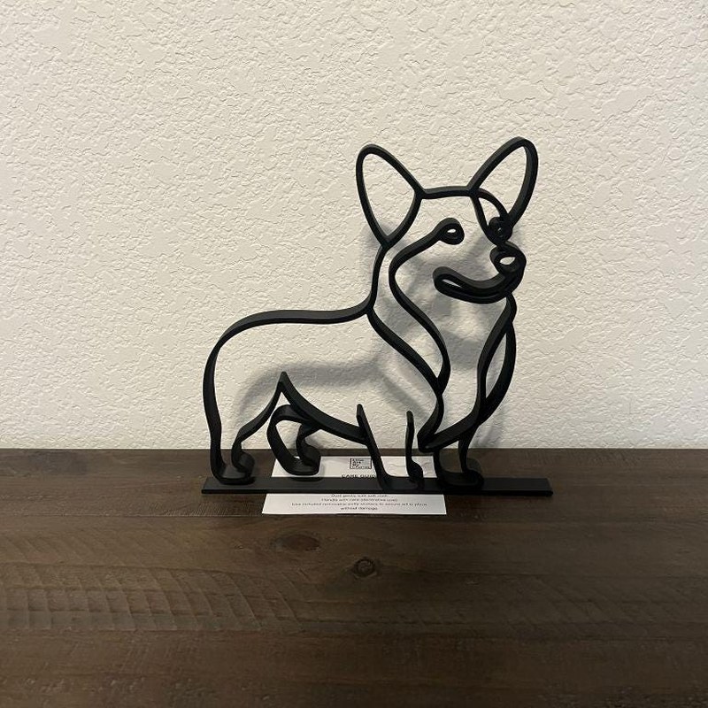 Customer photo of corgi sculpture displayed in an office